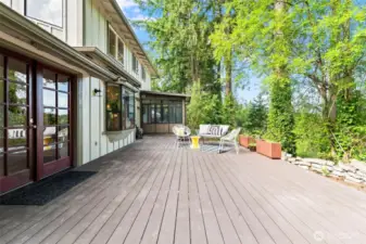 Large Azek (composite) deck is great for summer entertaining. Steel planters stay with the home.
