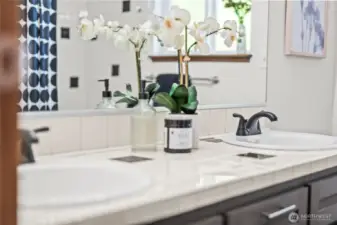 The full bath in the hall also has two sinks.