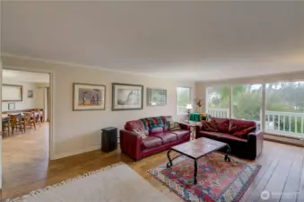 Family room with the kitchen and dining room in the background.