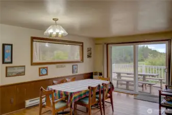 Dining room with ocean view and access to the wraparound deck.