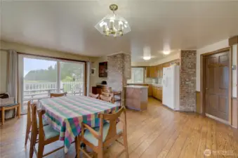 Dining room with ocean view and access to the wrap around deck. the doorway goes int0 the living room.