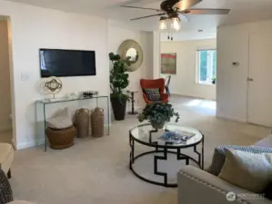 The main living room, looking towards the dining room and kitchen.