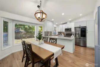 With updated flooring, this dining room that's perfectly situated off the family room and kitchen really 'wows'!