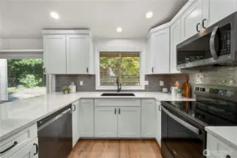 From quartz counters to updated cabinetry - this kitchen is a dream!