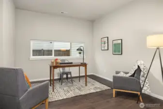 Office or media room on the first floor with same warm hardwood floors.