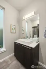 Powder on the main floor, as you can see in the mirror, has a FULL Shower.