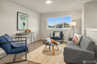 Upstairs open bonus room for movies, reading or play.