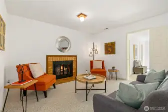 main floor family room with gas fireplace and adjoining main floor bedroom suite added in 2005 addition