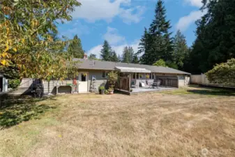 Delightful backyard is fully fenced. Large trex deck and retractable awning.