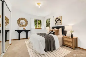 Guest bed #1, with large mirrored closets and corner windows