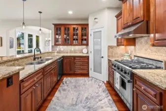 Chef’s kitchen with Viking/DCS appliances, walk-in pantry, custom cabinetry, and beautiful slab granite—designed for both function and elegance.