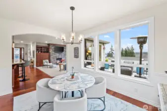 Casual dining area with panoramic views and access to the covered deck.  Ideal for morning coffee with Sound vistas.