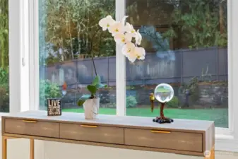 Serene garden outlook from the primary suite, offering peaceful morning light and a lush natural backdrop.