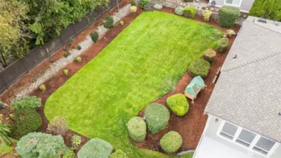 Expansive backyard with level lawn, mature landscaping, and privacy.  A rare in an in-town Gig Harbor setting.