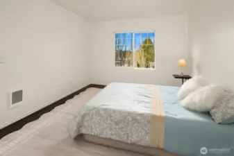 Primary Bedroom Suite w/ Laminate wood flooring