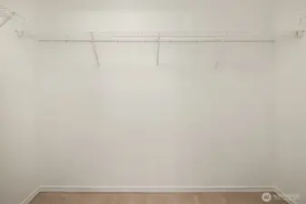 Spacious walk-in closet in the primary bedroom