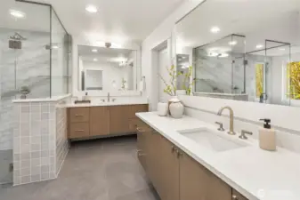 Duel vanities with slab counters and undermount sinks and custom built floating cabinets