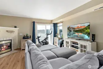 Enjoy the cozy fireplace and outdoor views from your living room.