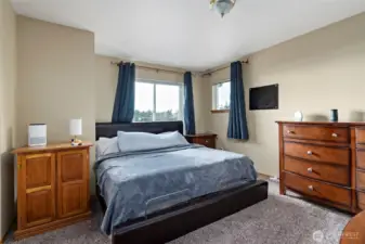 This window from primary bedroom has views to Oak Harbor.