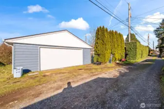 Oversized 2 car garage off alley plus addiotnal one car garage in front or use it as additional flex space