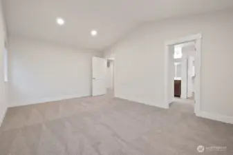Primary suite with vaulted ceilings