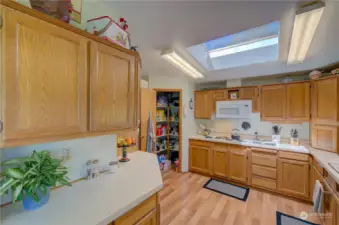 Kitchen with a large pantry, built in microwave and a pull down for cookbook/tablet