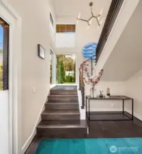 Architecturally dramatic entry. Or install an elevator and skip the stairs.