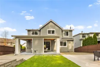 Fully landscaped yard with turf and pavers