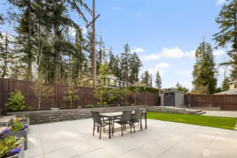 Fully landscaped yard with turf and pavers
