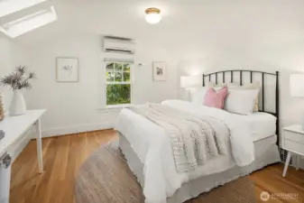#2 bedroom on upper level. Note two skylights and ductless A/C.