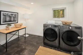 Lower level laundry room with plenty of space and a window too!