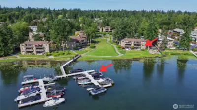 View of unit from the lake side along with deeded boat slip noted with an arrow