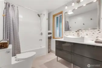 Large remodeled bathroom with full-size laundry!