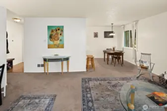 The dining room opens into a large open living room space.