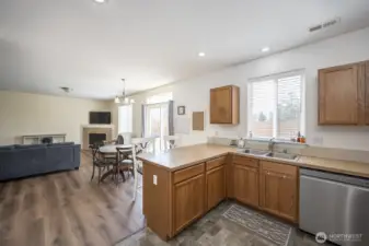 Kitchen with ample storage, looking towards dining area and living room