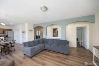 Living area looking towards 1/2 bath and laundry room