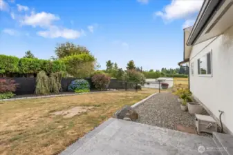 Front yard with mature landscaping and new stamped concrete patio