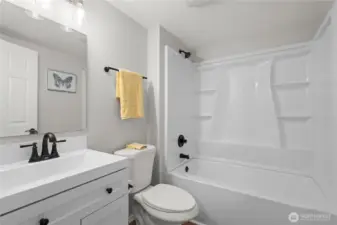 Primary Full Bath: New Vanity, Plumbing & Fixtures, Tub/Shower Surround, Toilet, Laminate Flooring.