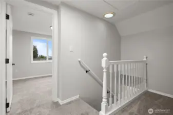 Top of the Stairs: Solar Tube adds some natural lighting to this landing area.