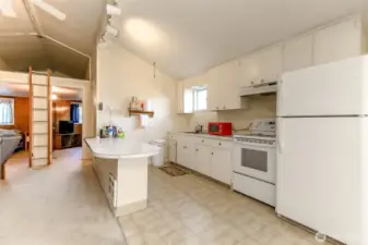 Kitchen with plenty of room and access to the loft area between he 2 bedrooms