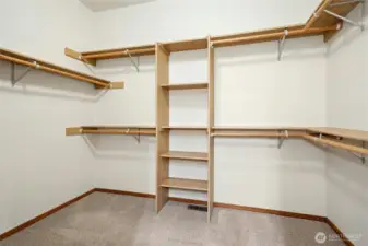 Primary bedroom walk in closet