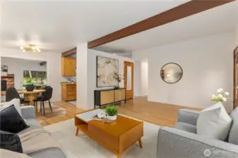 The entry level living area flows into the kitchen & dining space, with views into the second living and dining space beyond