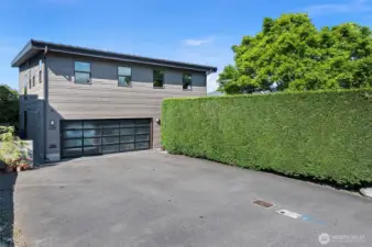 Street side of the home - plenty of parking in a spacious 2-car garage and car park.