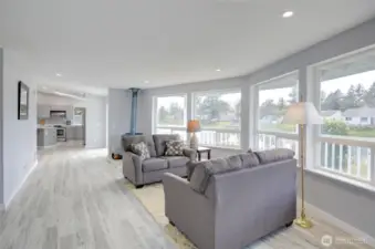 Living room with an abundance of windows and natural lighting. View of the water.
