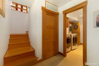 Ground floor entry mud room. Stairs lead to main floor, laundry room, 3/4 bath and 3 car garage through the door to the right in photo.