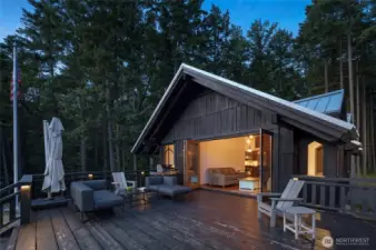 Nano-style doors fully open the west-facing wall to the deck.