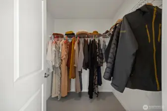 Walk-in closet in the primary suite.
