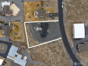 The property features a combination of graveled and natural landscaping areas. This description is provided as an estimated overview, and prospective buyers are advised to verify all property details and boundaries through independent inspection.
