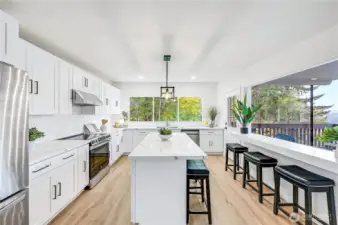 Island and seating at the breakfast bar, the views kitchen are very impressive.