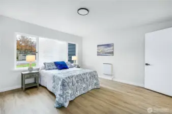 The primary suite is spacious with lots of natural light.